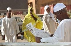 A_Sudanese_reads_a_daily_newspaper.jpg
