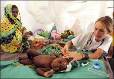 A_MSF_Doctor_treats_an_orphan_.jpg