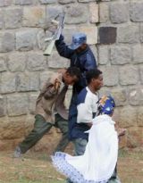 Ethiopian_policeman_beating_a_student.jpg