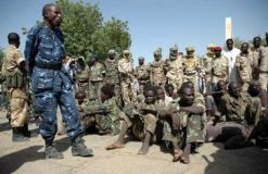 Chadian_soldiers_guard_rebel.jpg