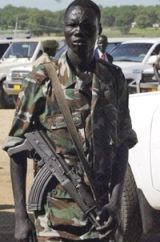 A SPLA soldier stands guard at the Juba airport in Sudan, June 2006. (AFP)