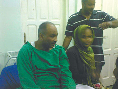 Mubarak Al-Fadil (left) with unidentified family members