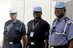 United Nations peacekeeping police officers pose in their new base in El Fasher, Darfur, Sudan, Friday, Jan. 25, 2008 (AP)