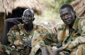 SPLA soldiers smoke cigarettes in a military barrack in Nabanga, near the Sudan-Congo border, Western Equatoria, April 12, 2008. (Reuters)