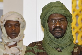 Khalil Ibrahim, the leader of the rebel Justice and Equality Movement (JEM), gestures during a  meeting with General Martin Luther Agwai, AMIS Force Commander, 17 October, at an unknown location on the Sudan-Chad border in north west Darfur (AFP)