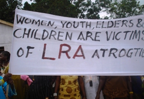 Protesters stand in front of the WES government premises holding banners against the LRA presence in their state and chanting anti LRA slogans like 