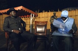 In this photo released by the United Nations Mission in Sudan (UNMIS), First Vice President of the Republic of Sudan and President of the Government of Southern Sudan Salva Kiir, left, sits after holding a press conference at his home after midnight to mark the launch of a census in Sudan, in Juba, southern Sudan, Tuesday, April 22, 2008 (AP)