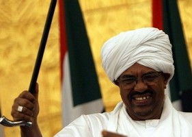 President Omar Hassan al-Bashir dances during the ceremony of signing Sudan's new election law in Khartoum July 14, 2008. (Reuters)