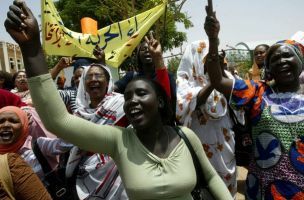 Women demonstrate outside parliament against a new election law in Khartoum, July 7, 2008. (Reuters)