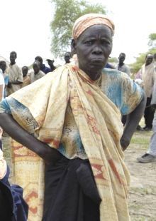 A woman displaced by fighting in Abyei wait to be registered at a UN WFP distribution point in the village of Abathok May 19, 2008. (Reuters)