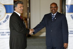 Turkey's President Abdullah Gul (L) and Sudan President Omer Hassan al-Bashir shake hands before the start of the Turkey-Africa Cooperation Summit in Istanbul August 19, 2008 (Reuters)