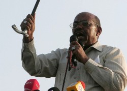 Sudanese President Omar al-Beshir speaks to a crowd of supporters in Nyala city in South Darfur on July 23, 2008 (AFP)