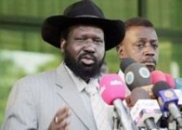 Sudan First Vice President Salva Kiir Mayadrit (L) and Luka Biong, minister of presidential affairs in the Government of Southern Sudan (GoSS)
