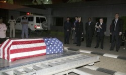 The flag-draped coffin of U.S. diplomat John Granville, 33, who worked for the U.S. Agency for International Development, is received by U.S. officials in Khartoum, Sudan, Thursday, Jan. 3, 2008 (AP)