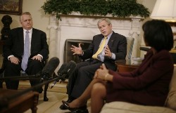 U.S. President George W. Bush (C) speaks alongside Special Envoy for Sudan, Richard Williamson (L) and Secretary of State Condoleezza Rice in the Oval Office of the White House in Washington January 17, 2008 (Reuters)