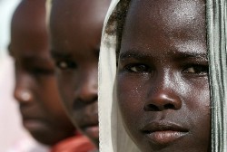 A picture taken on August 7, 2007 shows displaced Sudanese children attending a lesson in front of their school in the Sakali Displaced Person camp in Nyala, the capital of South Darfur state in western Sudan (AFP)