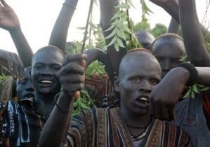 South Sudanese cattle herders from the Dinka ethnic group dance while watching a wrestling match in Bor in Jonglei State, 2008 (AFP)
