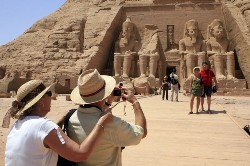 Tourists take pictures of the temple of Abu Simbel, south of Aswan, 800 kilometres south of Cairo on September 24, 2008 (AFP)