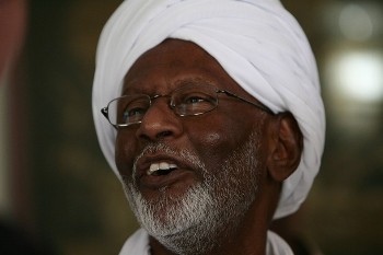 Islamist opposition leader Hassan al-Turabi, 76, speaks to journalists at his house in Khartoum March 9, 2009 (Reuters)
