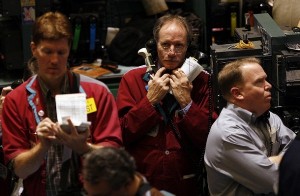 Traders work in the crude oil futures trading pit at the New York Mercantile Exchange (Reuters)