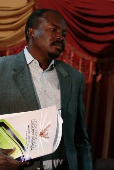 Sudans State Minister for Humanitarian Affairs Ahmed Haroun is seen after a news conference in Khartoum in Khartoum, Sudan Tuesday, March 10, 2009 (Reuters)
