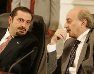 Lebanese majority leader Saad Hariri, left, speaks with Druze and PSP leader Walid Jumblatt, right (AP)