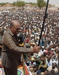 Sudanese President Omar al-Bashir greets several thousand of his supporters in the town of el Geneina in the far western part of Darfur, Sudan, Thursday, July 24, 2008 (AP)