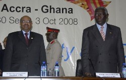 Sudan's President Omar Hassan al-Bashir (L) and his Ghanaian counterpart John Kufuor attend the opening of the 6th African, Caribbean, Pacific (ACP) summit at the Accra international conference centre October 2, 2008 (Reuters)