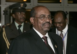Sudanese President Omar Hassan al-Bashir (C) leaves after a closed-door session at the 12th African Union Summit in Ethiopia's capital Addis Ababa February 4, 2009 (Reuters)