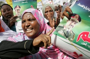 Sudanese women shout slogans during a demonstration organised by members of the main ruling National Congress Party in support of President Omar al-Beshir in Khartoum on July 28, 2008 (AFP)