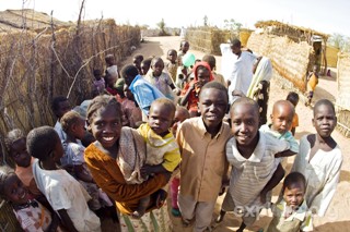Internally displaced women carry firewood to Kalma Camp, near Nyala in Darfur in this handout photograph released by MSF, April 3, 2008 (Reuters)