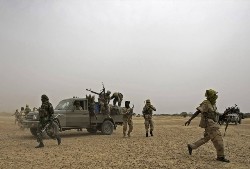 Fighters of the Justice and Equality Movement (JEM) dismount from their vehicles at an undisclosed location in Sudan's Western Darfur region (Reuters)