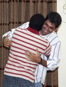 Italian doctor Mauro D'Ascanio (R) from the medical charity Medecins Sans Frontieres (MSF), who had been kidnapped, hugs his colleague after being released in Al Fasher, northern Darfur, March 14, 2009 (Reuters)