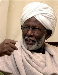 In this Sunday, July 17, 2005 file photo, Hassan Turabi speaks to the Associated Press after being released from a year and a half of house arrest for allegedly plotting a coup, in Khartoum, Sudan (AP)