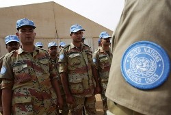 In a photograph made available by Albany Associates, newly arrived engineers from Egypt deployed to serve with the United Nations-African Union Mission in Darfur (UNAMID) peacekeeping operation in Sudan's remote, war-wracked western region, stand to attention 24 July 2008 (AFP)