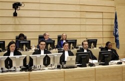 Judges of the International Criminal Court Akua Kuenyehia, president Claude Jorda and Sylvia Steiner, top left to right, are seen at the start of a hearing in The Hague, Netherlands, Thursday, Nov. 9, 2006 (AP)