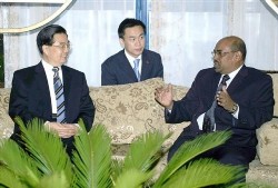 Sudanese president Omar Al-Bashir, right, meets with Chinese President Hu Jintao, left, upon his departure ending a two day visit in Khartoum, Sudan last year (AP)