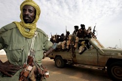 Rebels of the Sudan Liberation Army (SLA), loyal to leader Minni Minawi, ride at the back of a pick-up truck in El-Fasher, the administrative capital of North Darfur, on 19 September 2008 (AFP)