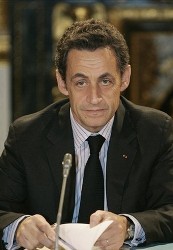 French President Nicholas Sarkozy listens as Britain's Prime Minister Gordon Brown, not seen, makes his introductory speech at a conference, in London, Monday Dec. 8, 2008 (AP)