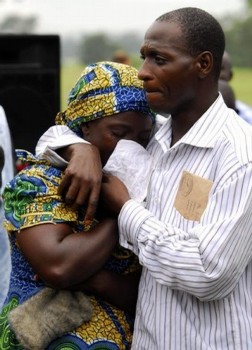 File photo showing relatives of one of the Nigerian peacekeepers killed in Darfur cry during a funeral ceremony in Abuja October 5, 2007 (Reuters)