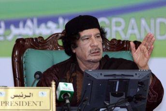 Libyan leader Moamer Gadhafi speaks during the opening session of the Cen-Sad summit in Sabratha on May 29, 2009. (Getty Images)