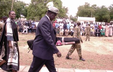 GoSS VP Dr. Riek Machar GoSS VP Dr. Riek Machar holding the Rod in a bag and matching in front of crowd, accompanied by his wife and State Minister of Energy and Mining, Angelina Teny, Juba, May 16, 2009 (ST-James Dak)