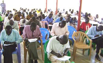 Jonglei youths attending test in a hall at Dr. John Garang Institute and the other photo shows youths struggling into a test room to take limited seats in the state police, on May 19, 2009 (photo ST- Philip Thon)