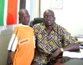 Umiyan John (left), the child resuced from Murle by SPLA posses for a photo with Deputy Gov. Hussien Mar Nyuot in Bor Town on Monday May 25, 2009. (Photo: ST Philip Thon Aleu)