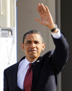 US President Barack Obama waves as he arrives in Air Force One at the US military airbase in the southern German city of Ramstein on June 5, 2009 (AFP)