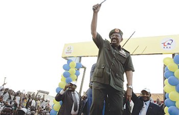 Sudanese president Omer Hassan Al-Bashir at the plane factory inaugration in Khartoum July 5, 2009 (AFP)