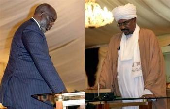 Sudanese president Omer Hassan Al-Bashir (R) abd late SPLM leader John Garang (L) are sworn in as president and first vice president of the Republic of Sudan in Khartoum, Saturday, July 9, 2005