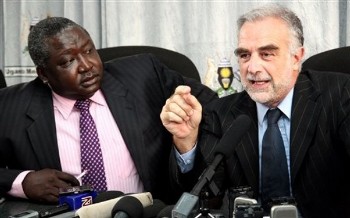 International Criminal Court Prosecutor, Louis Moreno-Ocampo, right, and State Minister for International Affairs Henry Oryem Okello, address a media conference at the government Media Centre in Kampala, Monday, July 13, 2009 (AP)