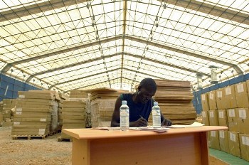 A worker from the Southern Sudan Commission for Census, Statistics and Evaluation (SSCCSE) prepares shipments for transport from their main warehouse in Juba to the ten states of Southern Sudan, on March 4, 2008 (AFP)