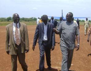 Gov. Kuol Mayan (R), Agot Alier, State minsiter of health (C) Speaker Jodi Boyoris (L) move at Bor airstrip on Sunday August 2, 2009 (Philip ThonAleu - ST)